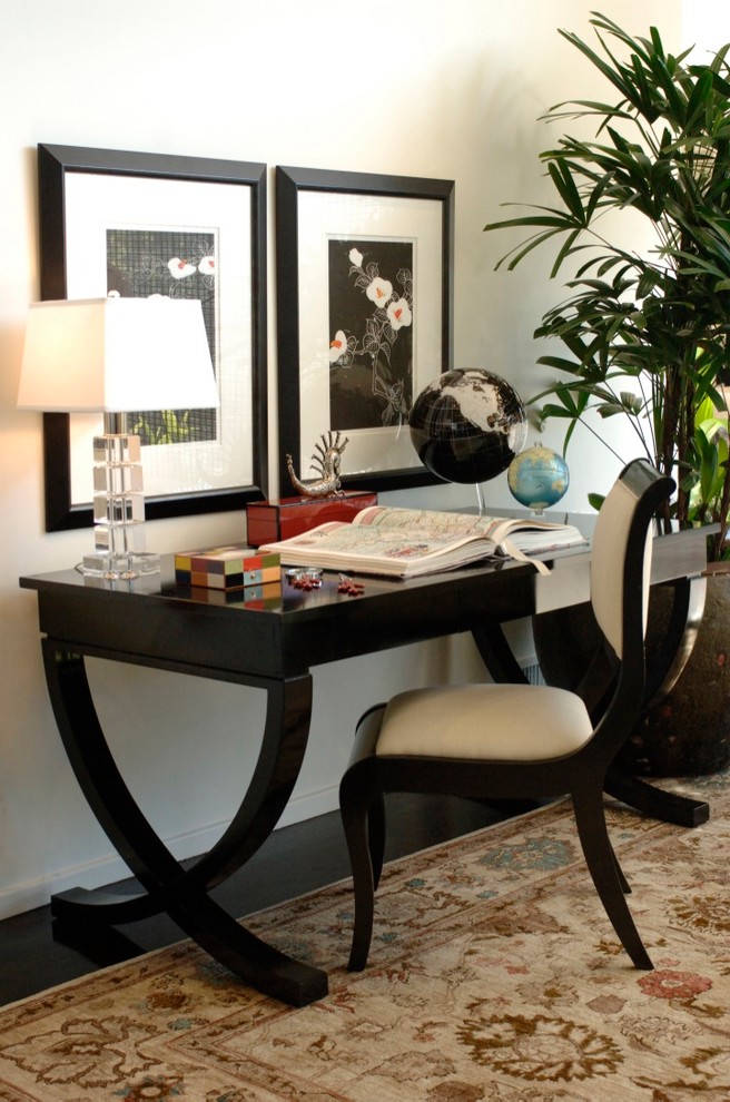 Photo of a small contemporary study room in Seattle with white walls, dark hardwood floors, a freestanding desk and brown floor.