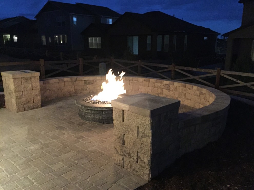 Inspiration for a large traditional backyard patio in Denver with a fire feature and no cover.