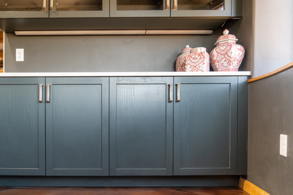 Inspiration for a transitional concrete floor kitchen remodel with shaker cabinets, blue cabinets and stainless steel appliances