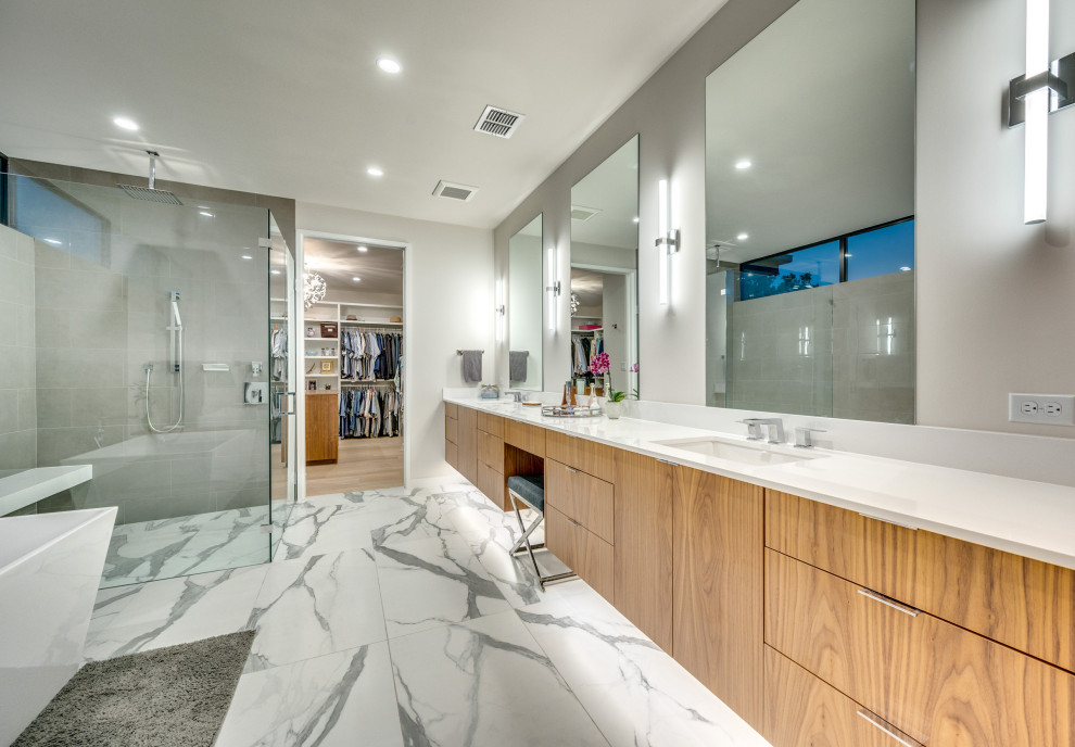 Inspiration for an expansive modern master bathroom in Austin with flat-panel cabinets, medium wood cabinets, quartzite benchtops, white benchtops, a double vanity and a floating vanity.