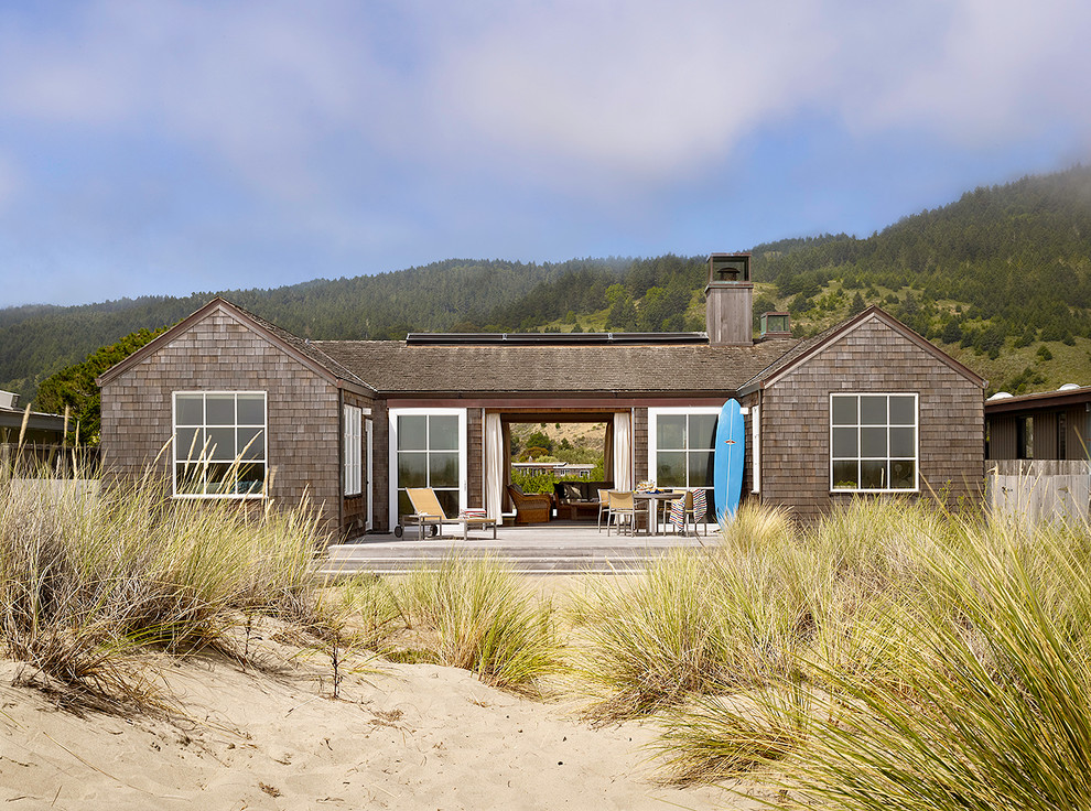 Design ideas for a small beach style one-storey exterior in San Francisco with wood siding and a gable roof.