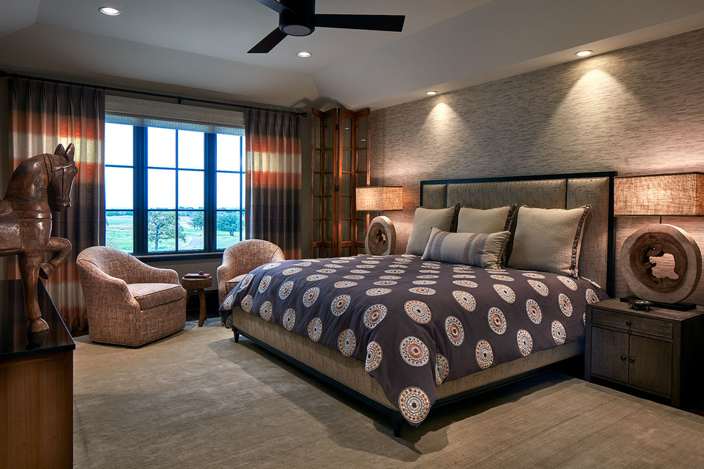 Large transitional guest bedroom in Dallas with beige walls, beige floor and carpet.