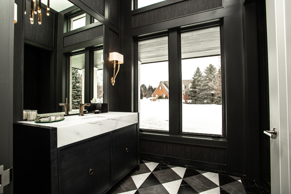 Design ideas for a transitional bathroom in Milwaukee with flat-panel cabinets, black cabinets, black walls, an undermount sink, multi-coloured floor and white benchtops.
