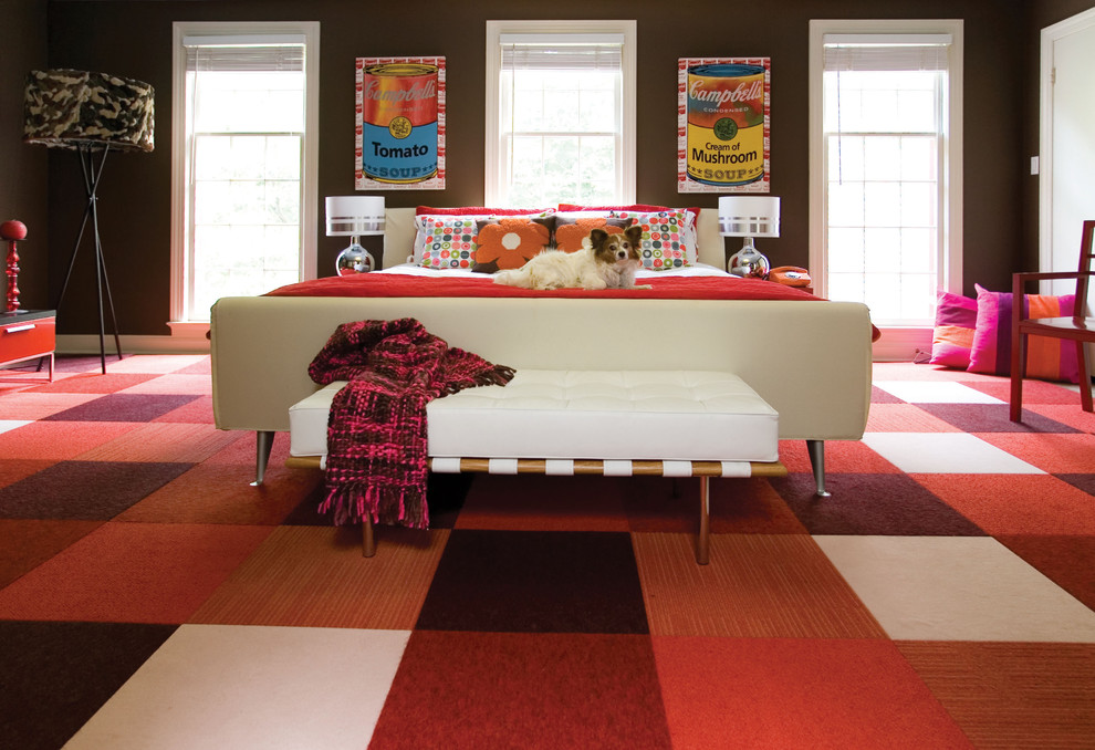 Photo of a contemporary bedroom in DC Metro with brown walls, carpet and red floor.