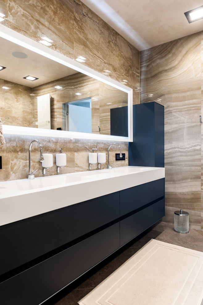 Mid-sized contemporary master bathroom in Saint Petersburg with black cabinets, a freestanding tub, a corner shower, a wall-mount toilet, beige tile, porcelain tile, porcelain floors, beige floor, a sliding shower screen and white benchtops.
