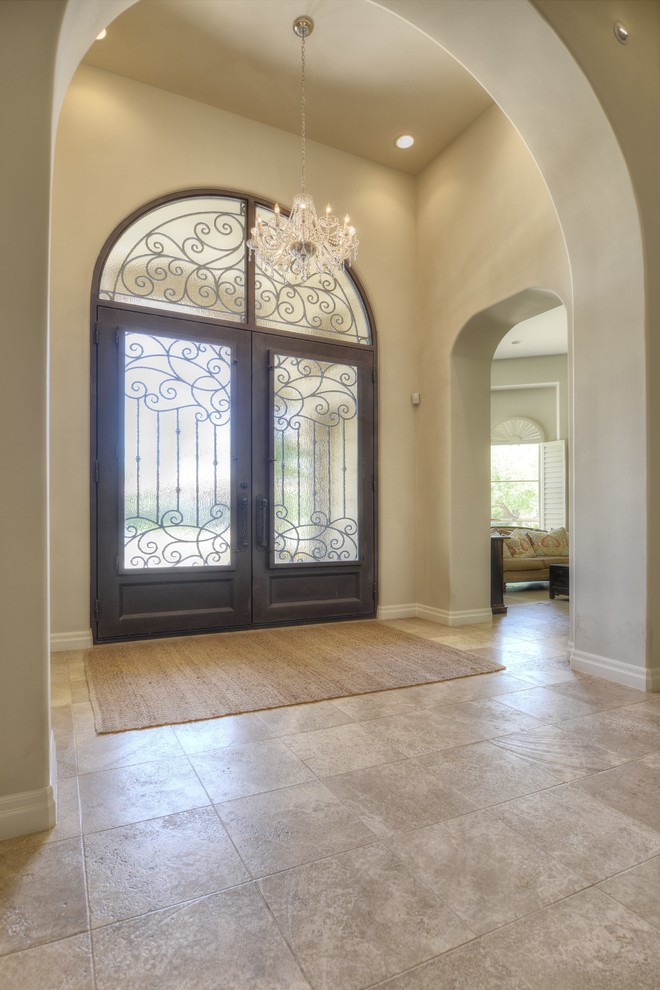 Example of a large transitional entryway design in Phoenix with a metal front door