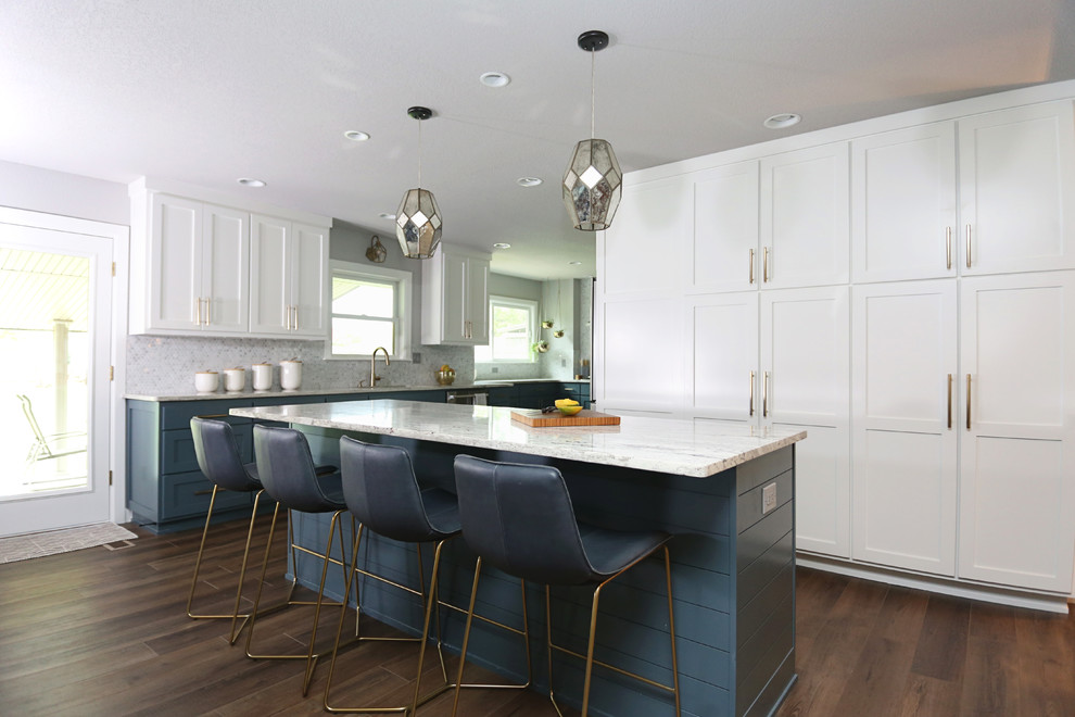 Inspiration for a transitional l-shaped dark wood floor and brown floor open concept kitchen remodel with recessed-panel cabinets, black cabinets, gray backsplash, an island and beige countertops