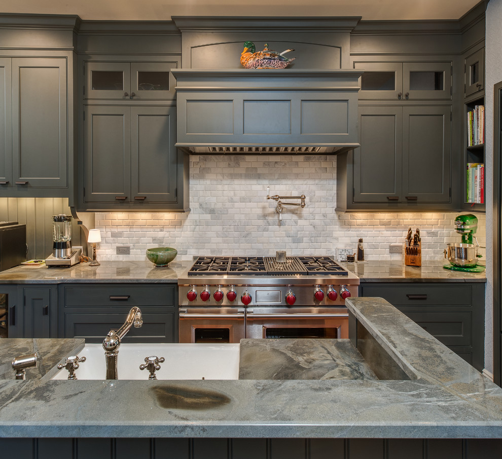 Photo of a large eclectic single-wall separate kitchen in Other with a farmhouse sink, beaded inset cabinets, grey cabinets, granite benchtops, grey splashback, stone tile splashback, stainless steel appliances, medium hardwood floors and with island.