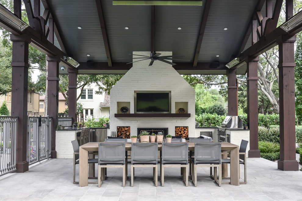 This is an example of a transitional patio in Houston with tile and a gazebo/cabana.