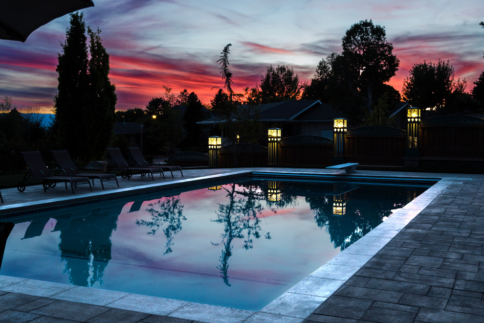 Inspiration for a large transitional backyard stamped concrete and rectangular pool landscaping remodel in Salt Lake City
