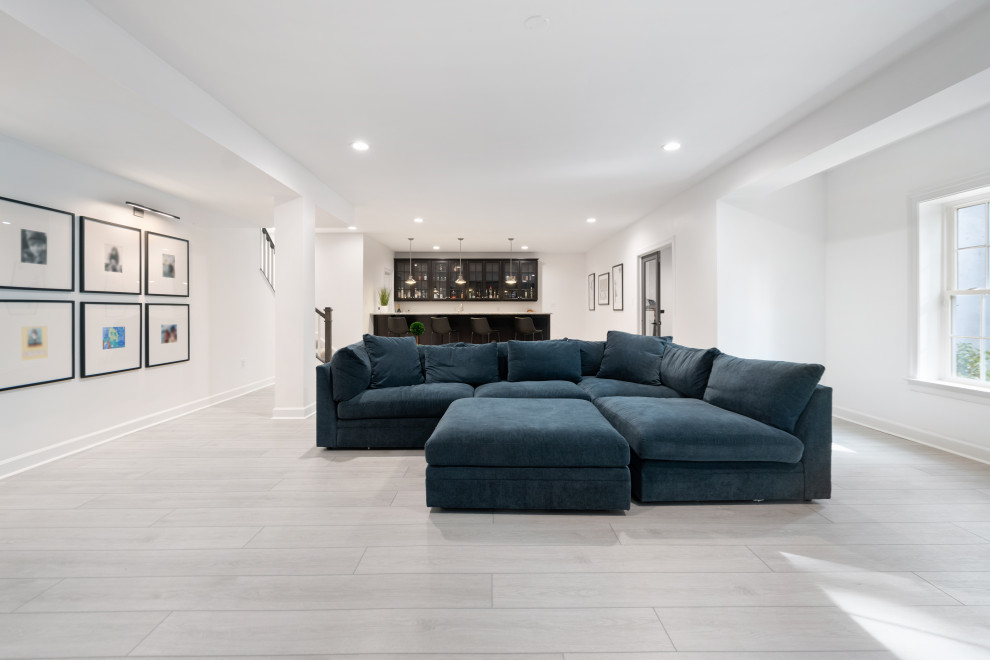 Mid-sized modern open concept living room in Richmond with white walls, vinyl floors, a built-in media wall and grey floor.