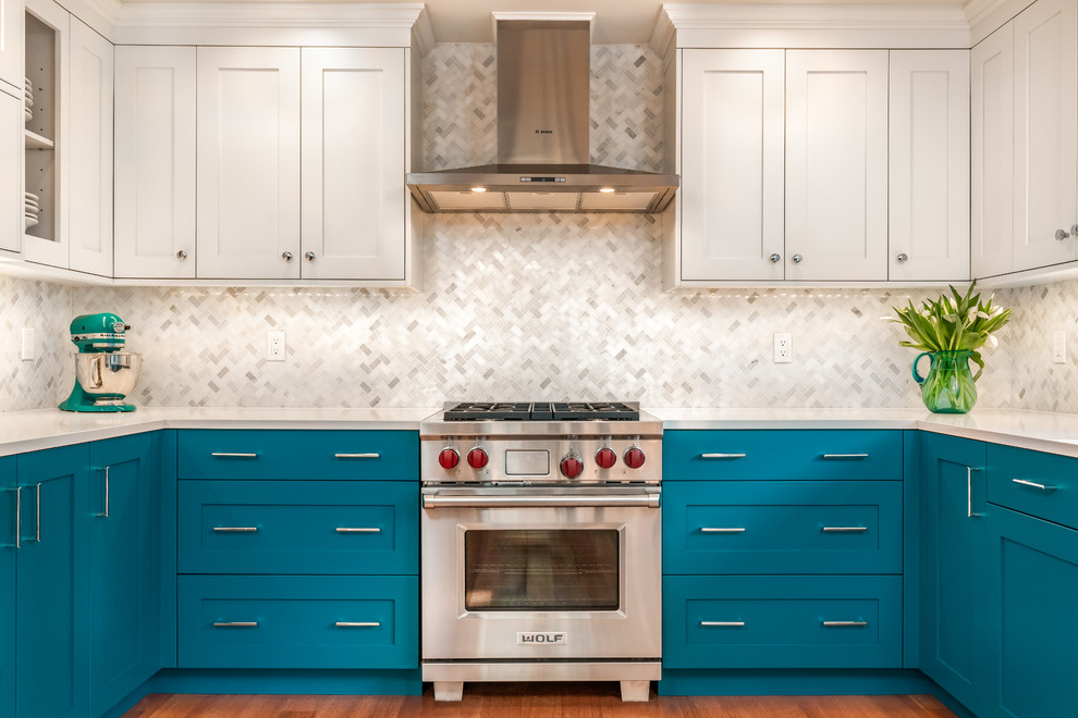 Kitchen pantry - small transitional u-shaped light wood floor kitchen pantry idea in Seattle with an undermount sink, shaker cabinets, blue cabinets, quartz countertops, white backsplash, marble backsplash, stainless steel appliances and white countertops