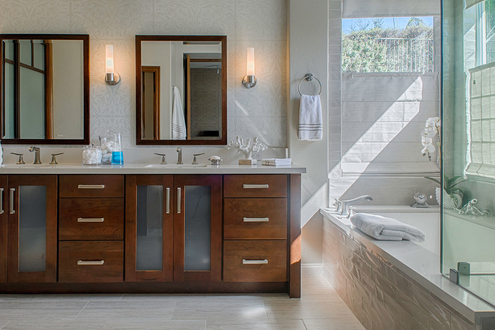 Inspiration for a large beach style master bathroom in Los Angeles with an undermount sink, flat-panel cabinets, engineered quartz benchtops, a corner shower, beige tile, white tile, subway tile, dark wood cabinets, an undermount tub, white walls, vinyl floors, beige floor and a hinged shower door.