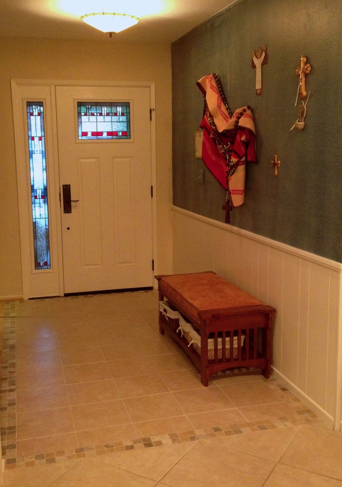 Photo of a small arts and crafts foyer in Los Angeles with blue walls, ceramic floors, a single front door and a white front door.