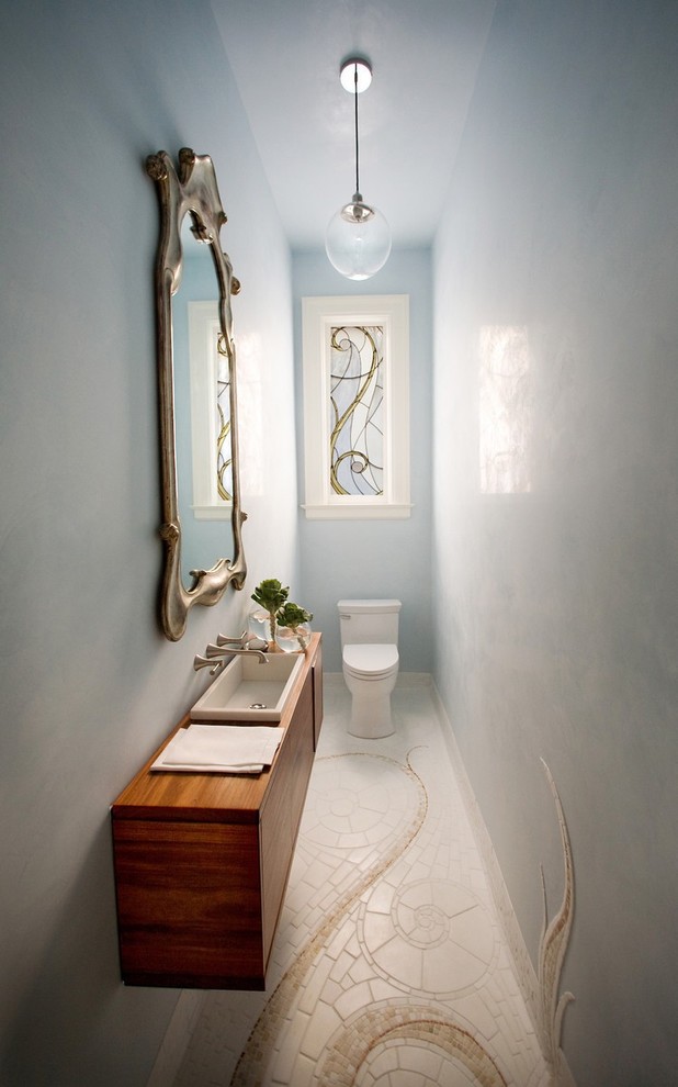 This is an example of a traditional powder room in San Francisco with a drop-in sink.