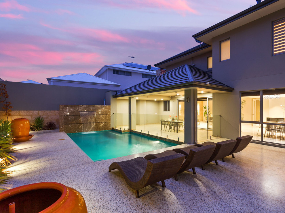 Photo of a small contemporary backyard l-shaped pool in Perth.