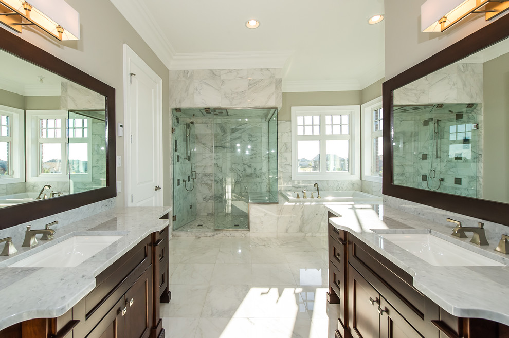 Inspiration for a large contemporary master bathroom in Edmonton with a drop-in sink, beaded inset cabinets, solid surface benchtops, a claw-foot tub, white tile, ceramic tile, white walls and ceramic floors.