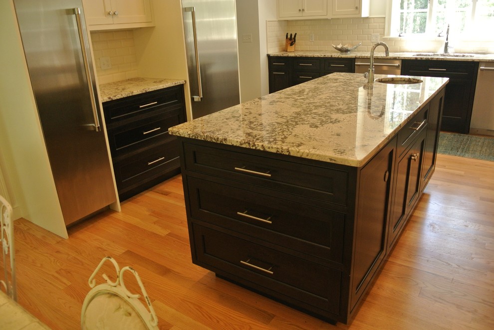 Transitional light wood floor eat-in kitchen photo in Boston with an undermount sink, shaker cabinets, granite countertops, white backsplash, subway tile backsplash, stainless steel appliances and an island