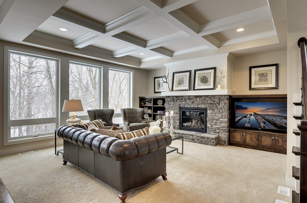 Photo of a large transitional open concept living room in Minneapolis with beige walls, carpet, a standard fireplace, a stone fireplace surround and a built-in media wall.