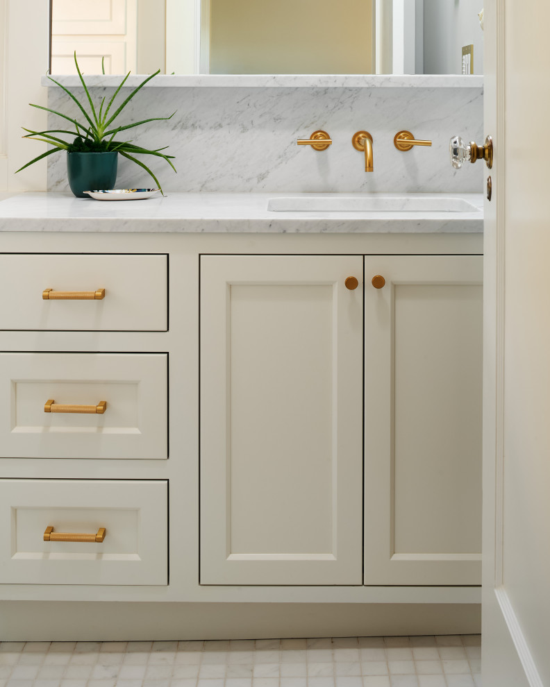 Bathroom - small green tile and ceramic tile marble floor, white floor, single-sink and vaulted ceiling bathroom idea in Portland with shaker cabinets, white cabinets, a one-piece toilet, white walls, an undermount sink, marble countertops, white countertops and a built-in vanity