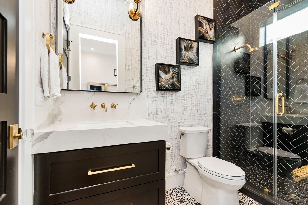 Inspiration for a transitional bathroom in Houston with shaker cabinets, black cabinets, an alcove shower, black tile, white walls, an undermount sink, multi-coloured floor and white benchtops.