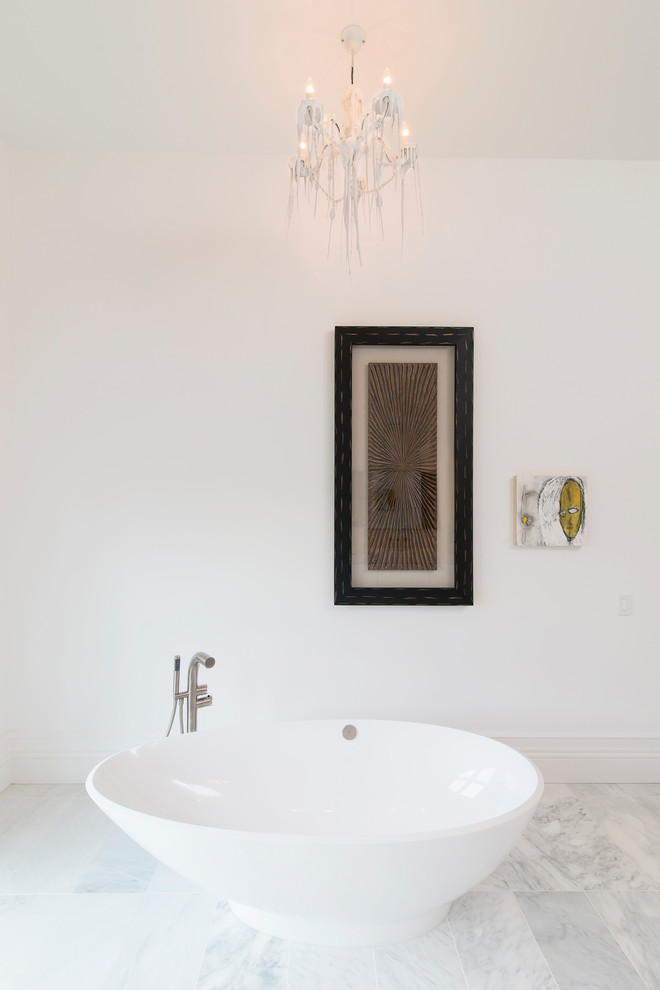 Design ideas for a contemporary bathroom in DC Metro with a freestanding tub and white walls.