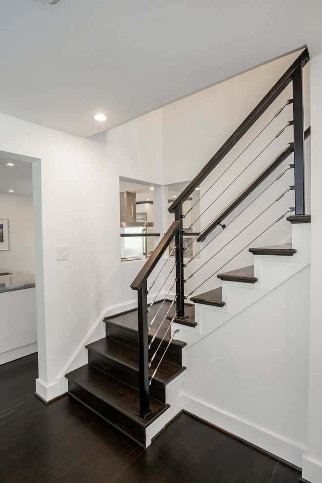 Mid-sized contemporary wood l-shaped staircase in DC Metro with wood risers.