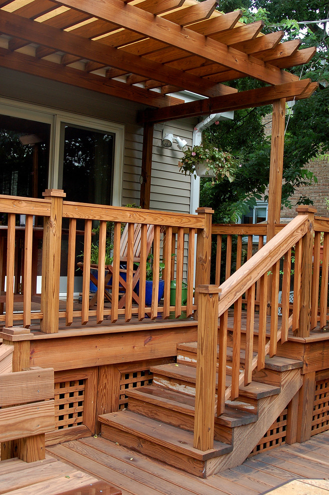 Inspiration for a traditional deck in Chicago with a pergola and a container garden.