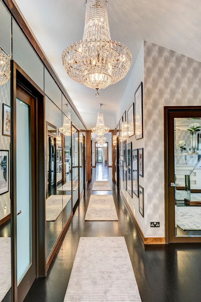 This is an example of a mid-sized traditional hallway in London with black floor.