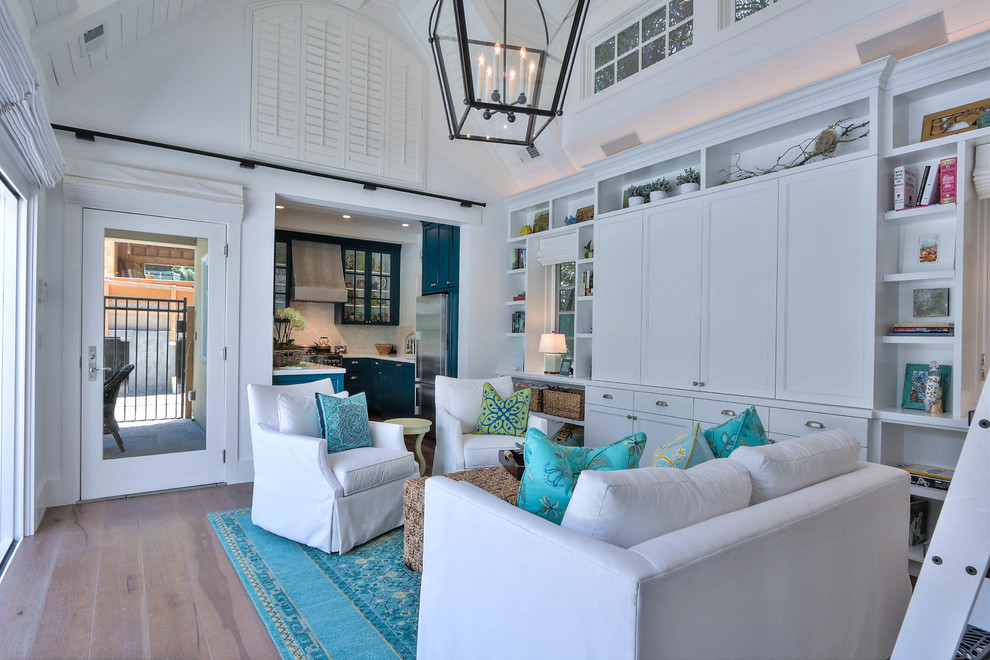 Photo of a mid-sized beach style enclosed living room in San Francisco with white walls and light hardwood floors.