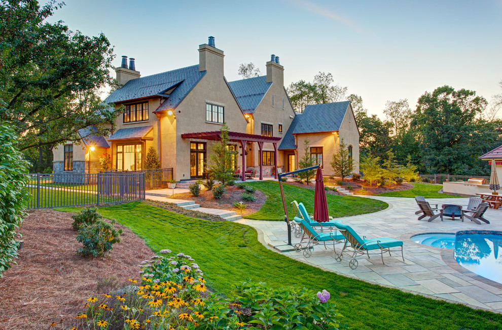 Inspiration for a mid-sized transitional backyard tile and kidney-shaped pool house remodel
