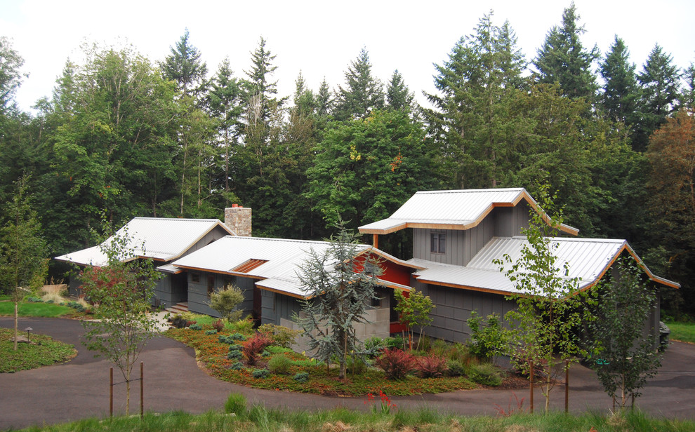 This is an example of a mid-sized country grey exterior in Portland.