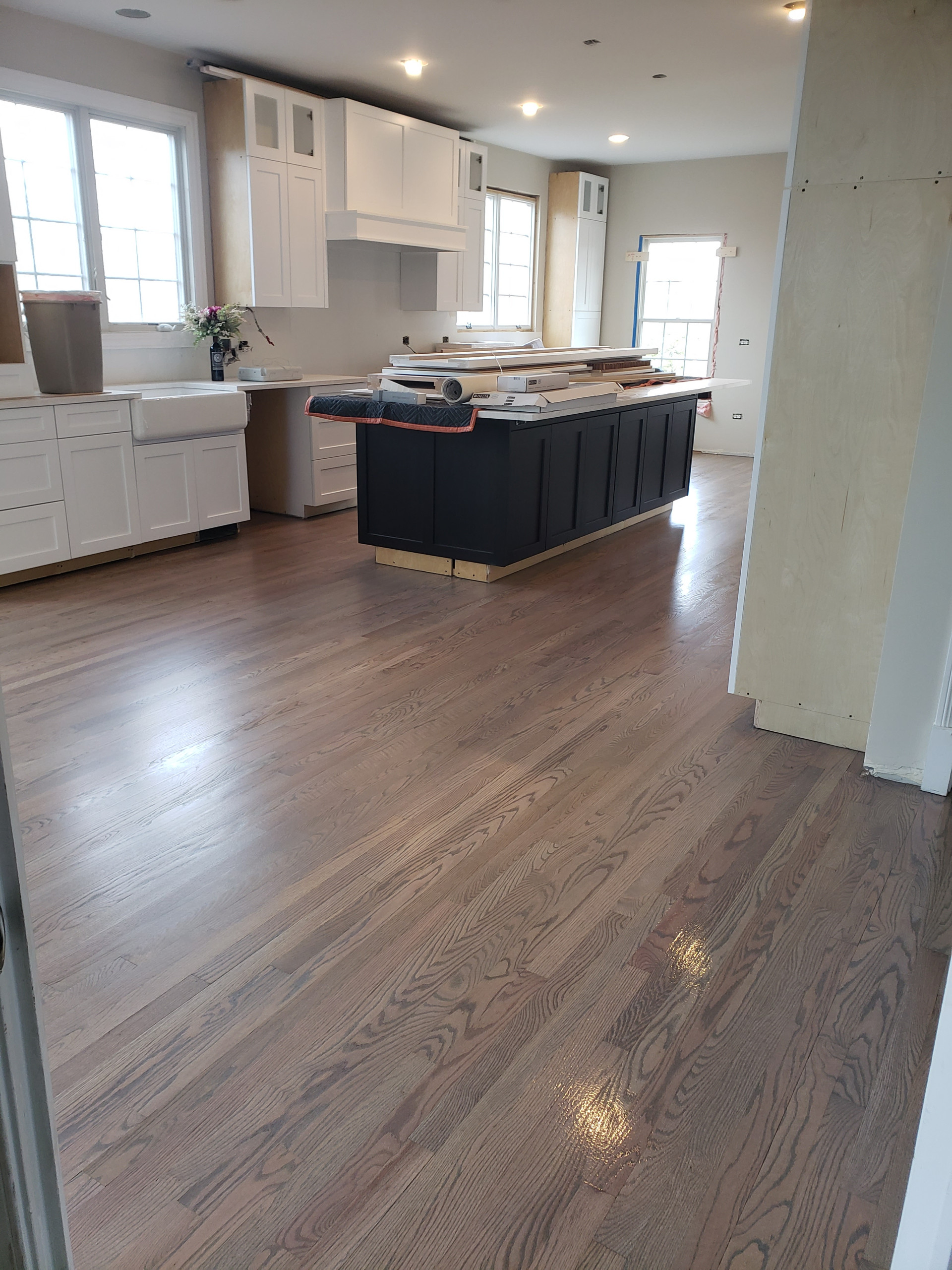 New 2 and 1/4 red oak flooring installed and old flooring refinished