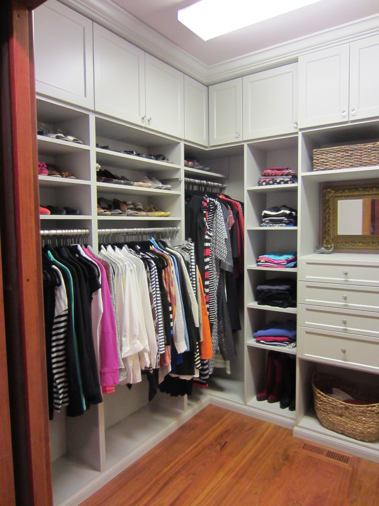 Closet - mid-sized traditional closet idea in Other