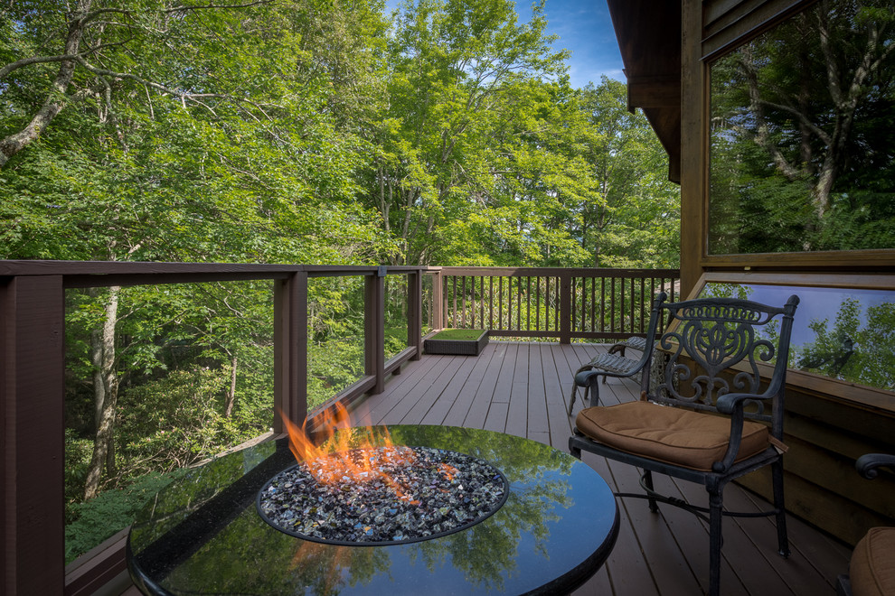 Inspiration for a large country backyard deck in Charlotte with a fire feature and no cover.