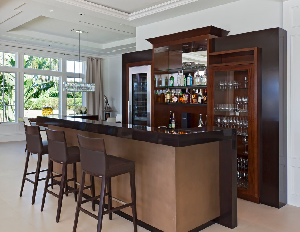 Photo of a contemporary galley seated home bar in Miami with glass-front cabinets and dark wood cabinets.