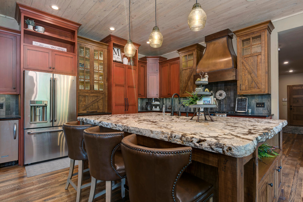 Kitchen - large rustic kitchen idea with shaker cabinets, medium tone wood cabinets and an island