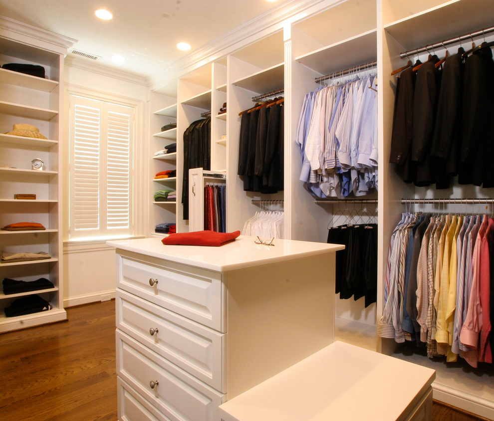 Inspiration for a large traditional men's walk-in wardrobe in Louisville with raised-panel cabinets, white cabinets, light hardwood floors and brown floor.