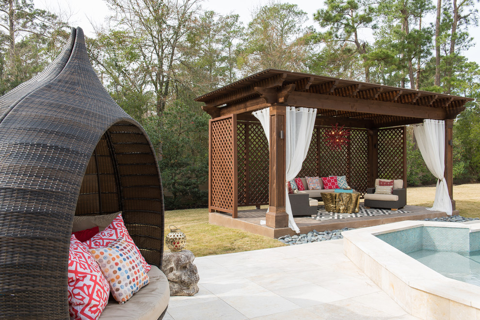 Photo of a contemporary backyard patio in Houston with stamped concrete and a gazebo/cabana.
