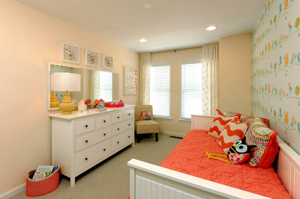 This is an example of a traditional gender-neutral kids' bedroom in DC Metro with beige walls and carpet.
