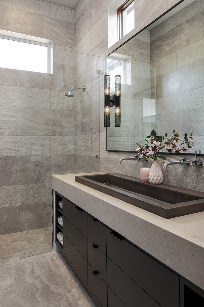 Photo of a mid-sized modern master bathroom in Miami with flat-panel cabinets, black cabinets, an alcove shower, gray tile, a trough sink, grey floor, an open shower, grey benchtops and grey walls.