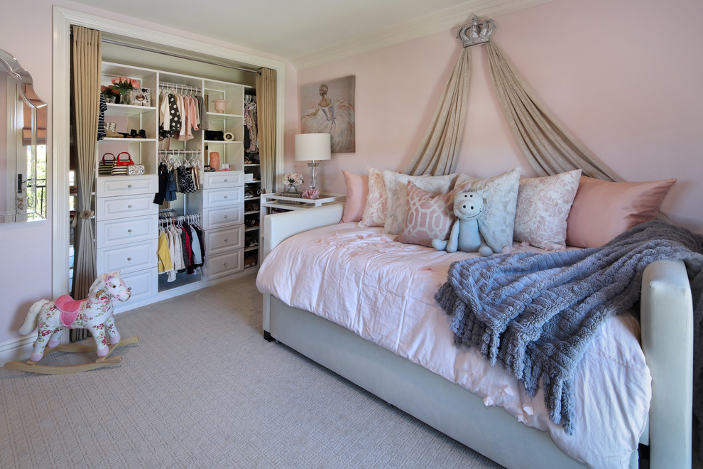 Inspiration for a mid-sized contemporary kids' bedroom for kids 4-10 years old and girls in Orange County with pink walls, carpet and grey floor.