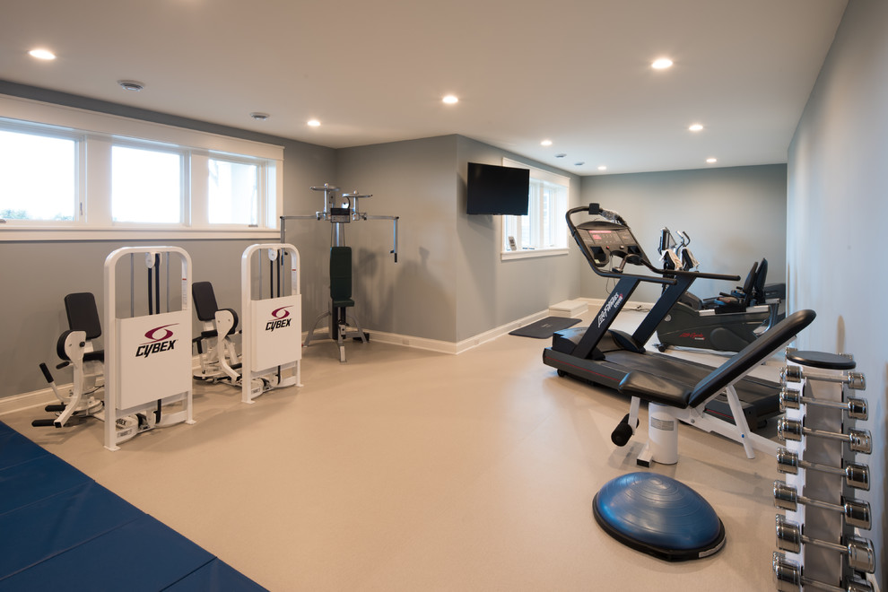 Photo of a large traditional home weight room in Minneapolis with blue walls and beige floor.
