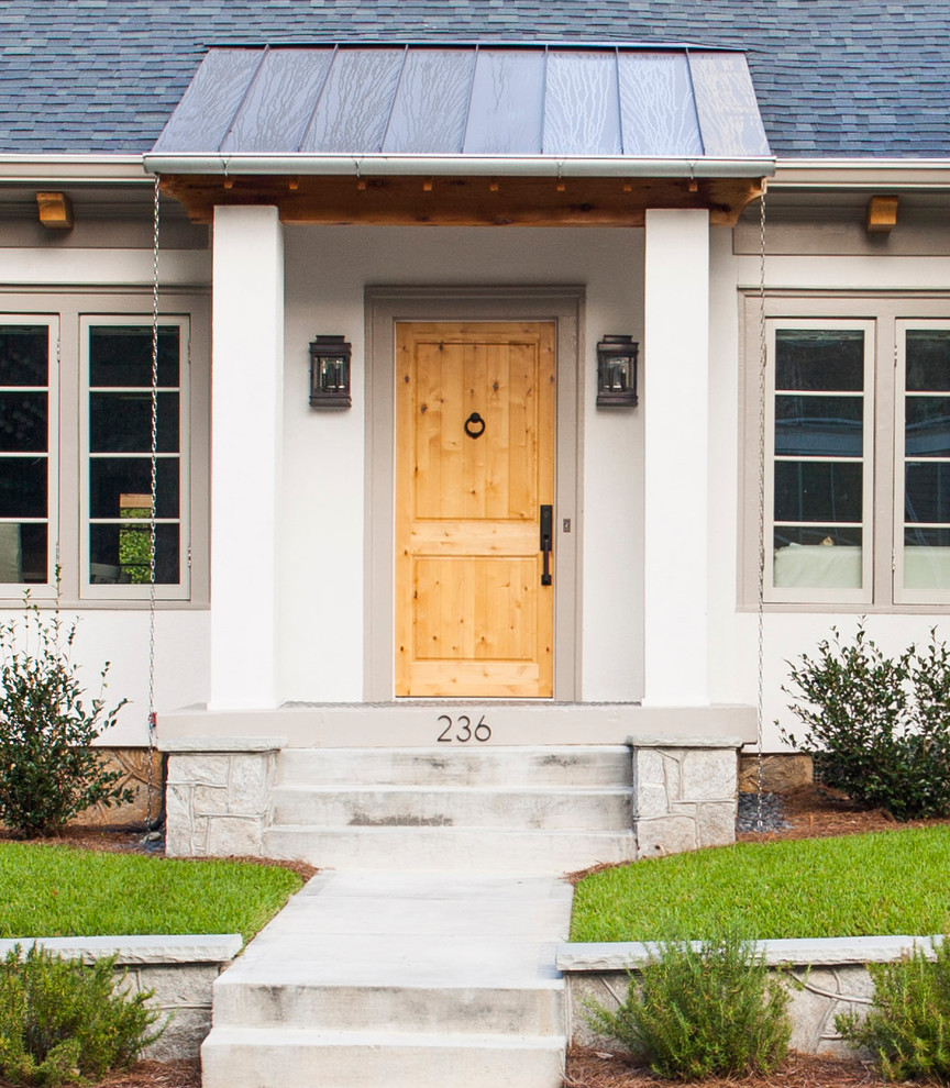 Mid-sized transitional front door in Atlanta with a single front door and a light wood front door.