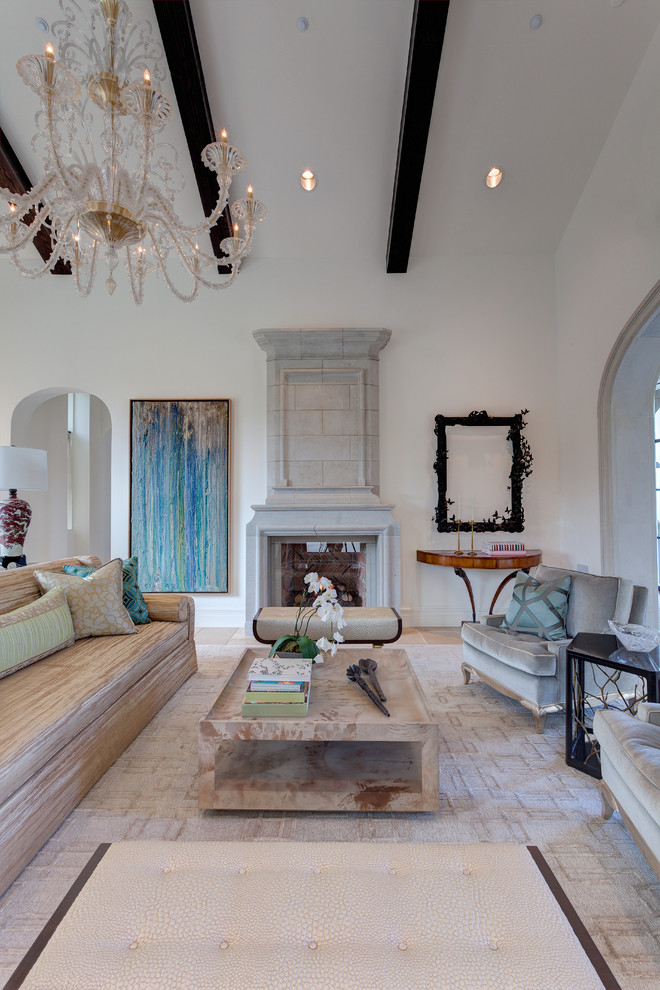 Inspiration for an expansive mediterranean formal open concept living room in Dallas with white walls, limestone floors, a standard fireplace, a stone fireplace surround and no tv.