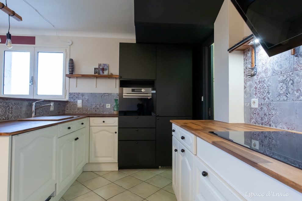 Photo of a country separate kitchen in Lyon with an undermount sink, wood benchtops and ceramic splashback.