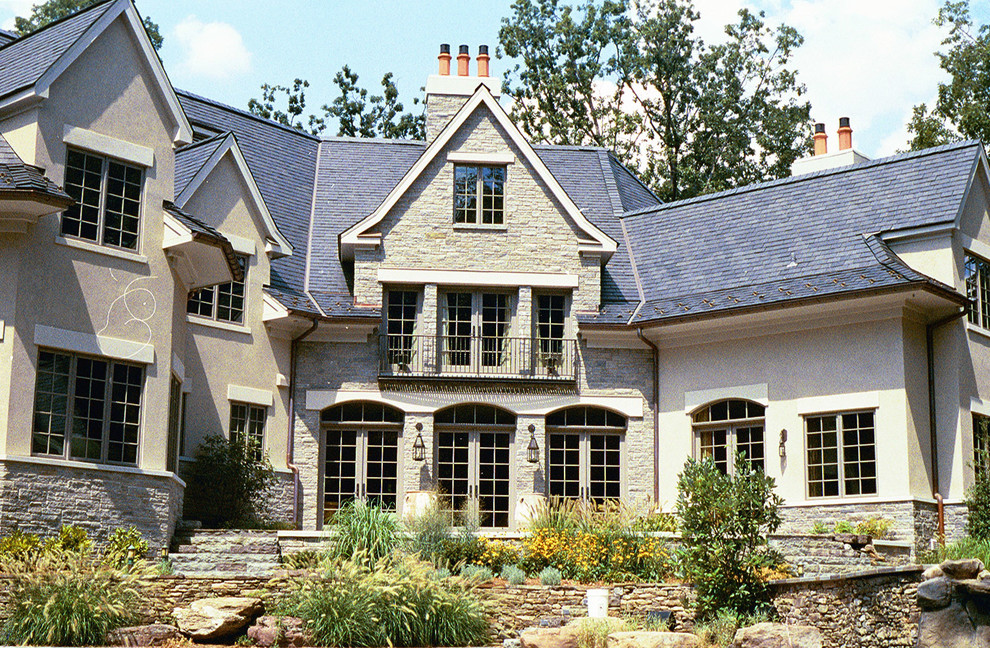 Inspiration for a timeless two-story stone exterior home remodel in DC Metro