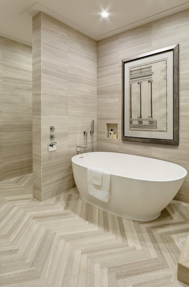Design ideas for a large contemporary master bathroom in New York with an undermount sink, flat-panel cabinets, light wood cabinets, limestone benchtops, a freestanding tub, a corner shower, a one-piece toilet, brown tile, stone tile, brown walls and limestone floors.
