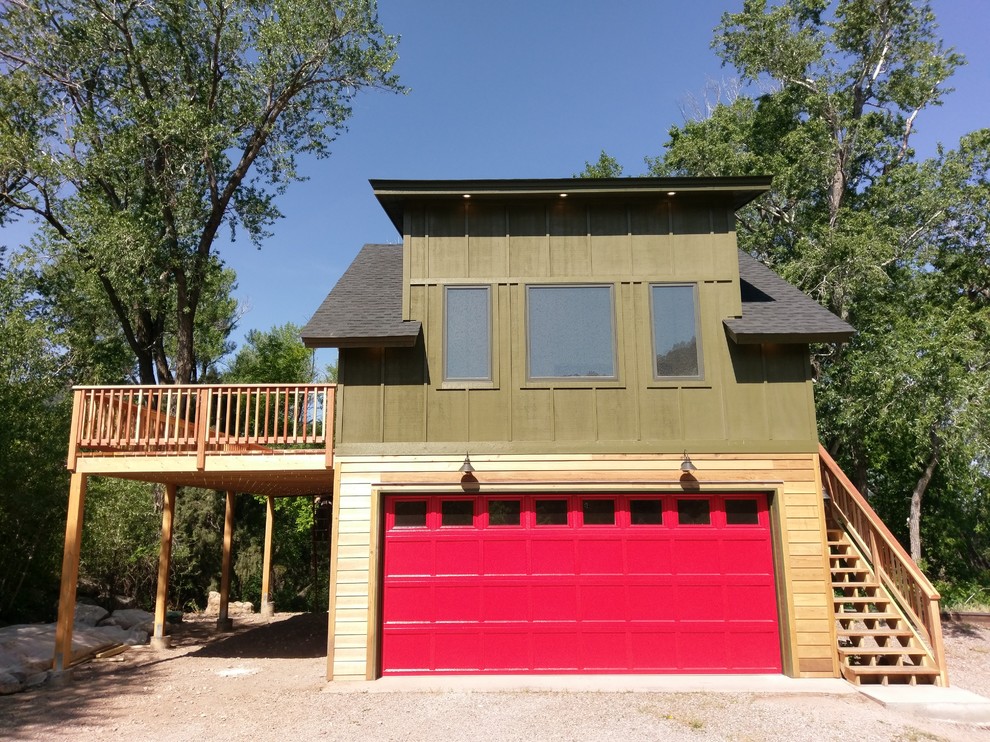 Mid-sized contemporary two-storey green exterior in Denver with mixed siding and a hip roof.