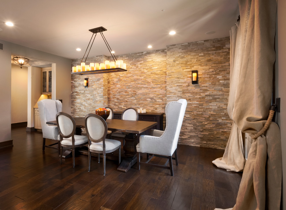 This is an example of a large country separate dining room in Detroit with beige walls, dark hardwood floors and no fireplace.